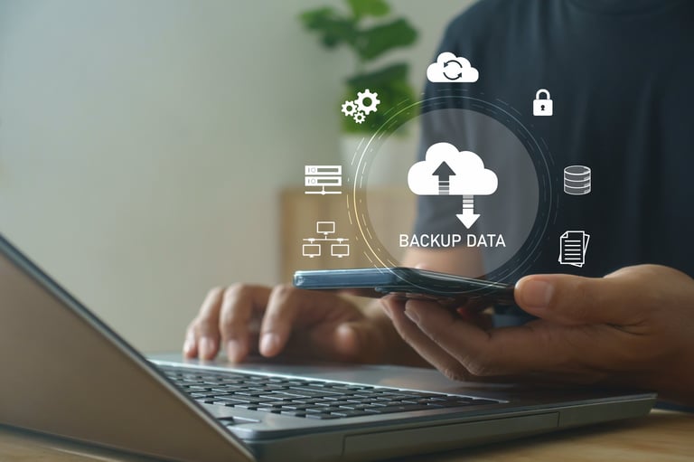 Cloud data backup concept — person using a laptop to sync files securely online, illustrating cloud storage and data protection